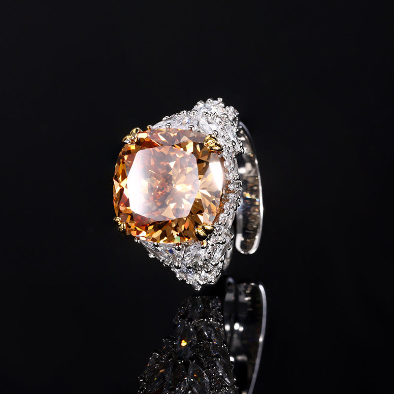 A silver plating beige cocktail brass ring, inlaid with a beige center stone and white marquise-cut zirconias.
