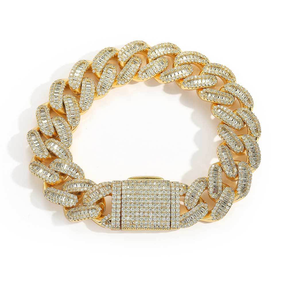 A chunky iced out cuban link bracelet. White baguetee zirconias, iced out box clasp. Brass with gold plating.