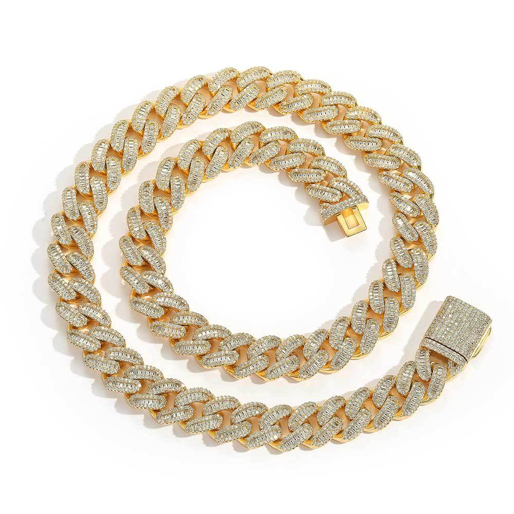 A chunky iced out cuban link necklace. White baguetee zirconias, iced out box clasp. Brass with gold plating.