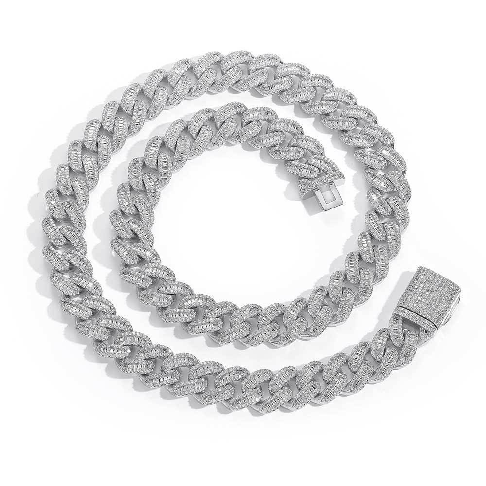 A chunky iced out cuban link necklace. White baguetee zirconias, iced out box clasp. Brass with silver plating.