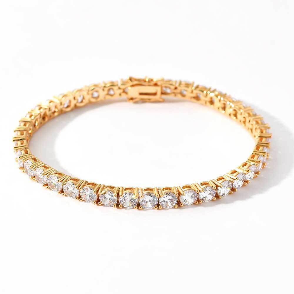 A cubic zirconia tennis chain bracelet. Inlaid with white zirconias, brass with gold plating.