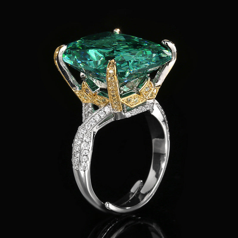 The ring of the emerald zirconia jewelry set, inlaid with a large emerald-cut green center stone, pave band. Brass with silver-gold plating.