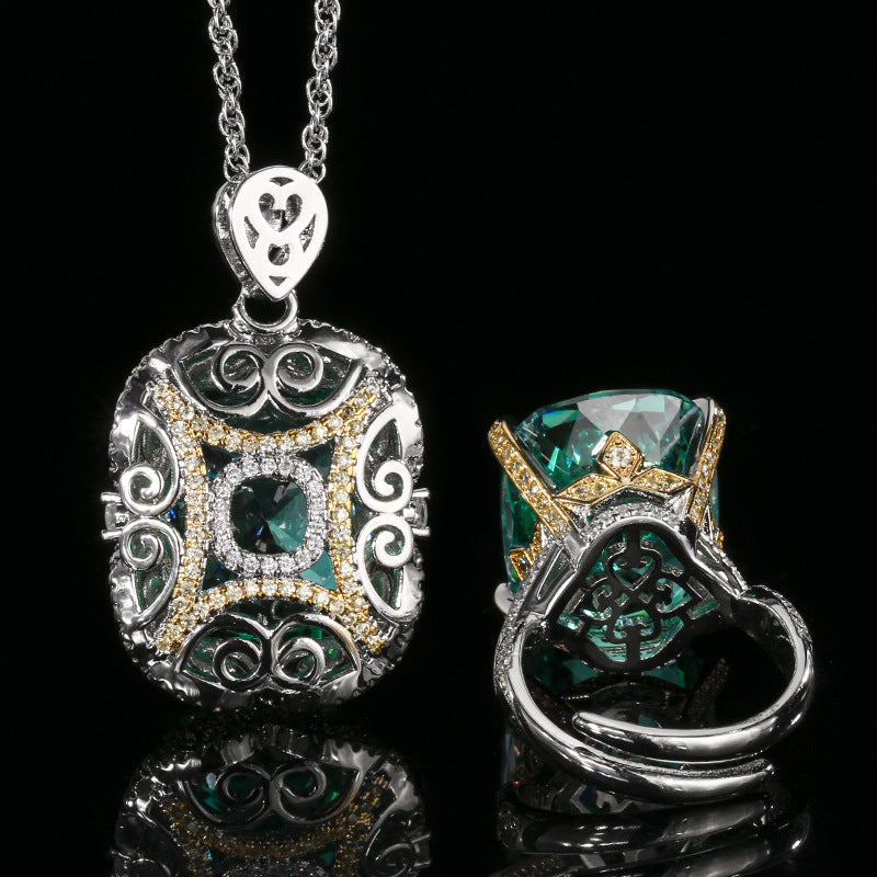The back of the emerald zirconia jewelry set, the necklace and ring design in openwork setting with pave white zirconias. Brass with silver-gold plating.