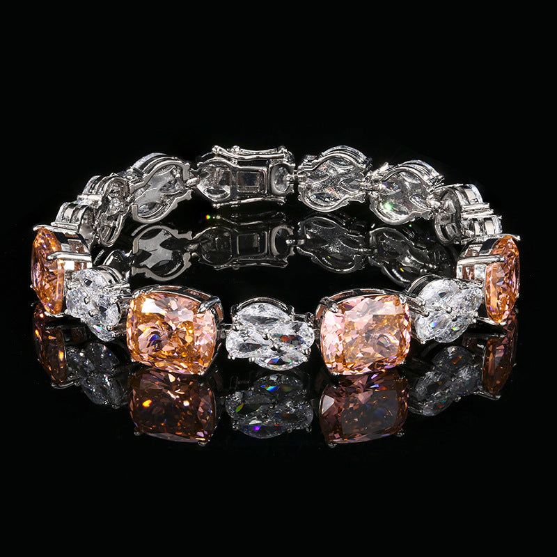 A brass bracelet alternating between paparadscha and white zirconia. Plating with silver.