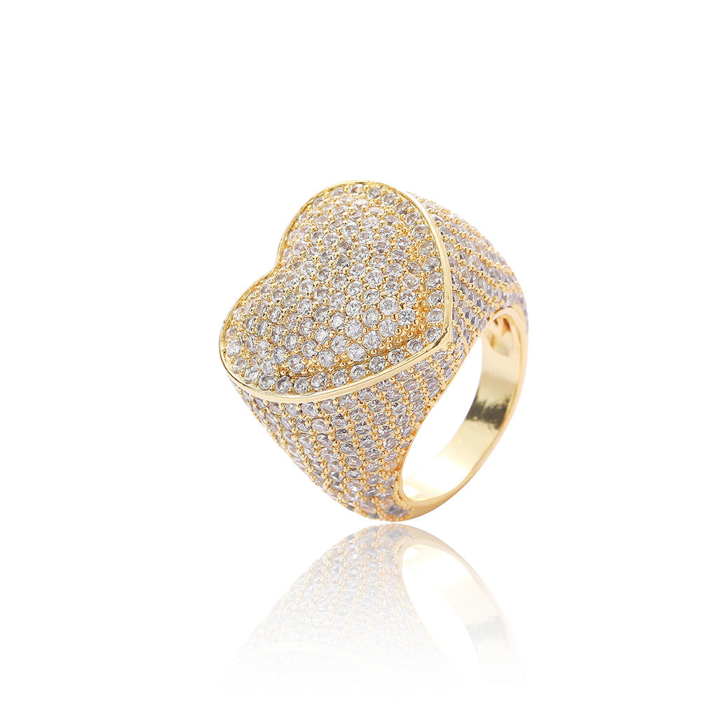 Iced out heart ring pave white round brilliant cubic zirconias. Brass with gold plating.