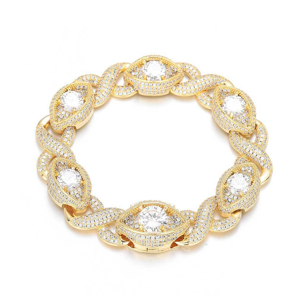 An iced out luxury evil eyes bracelet, infinity symbol, evil eye design in white zirconias. Iced out box clasp. Brass with gold plating.