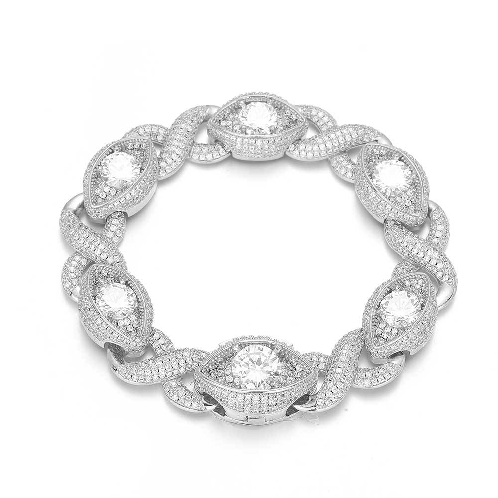An iced out luxury evil eyes bracelet, infinity symbol, evil eye design in white zirconias. Iced out box clasp. Brass with silver plating.