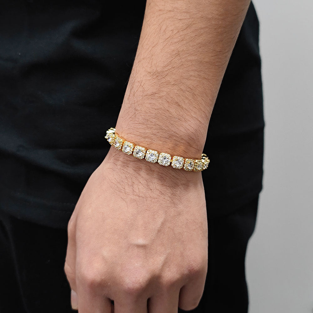 The model showcases the iced out square links tennis bracelet.