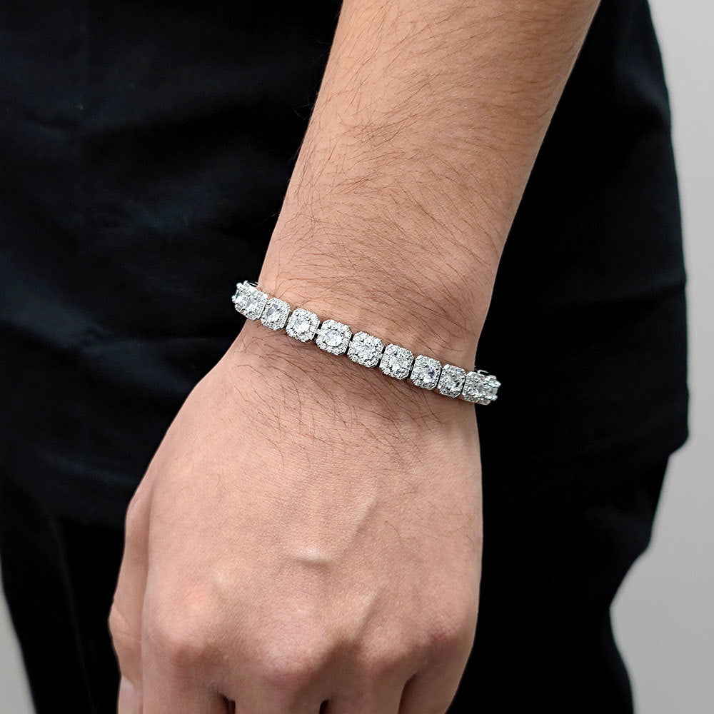 The model showcases the iced out square links tennis bracelet.