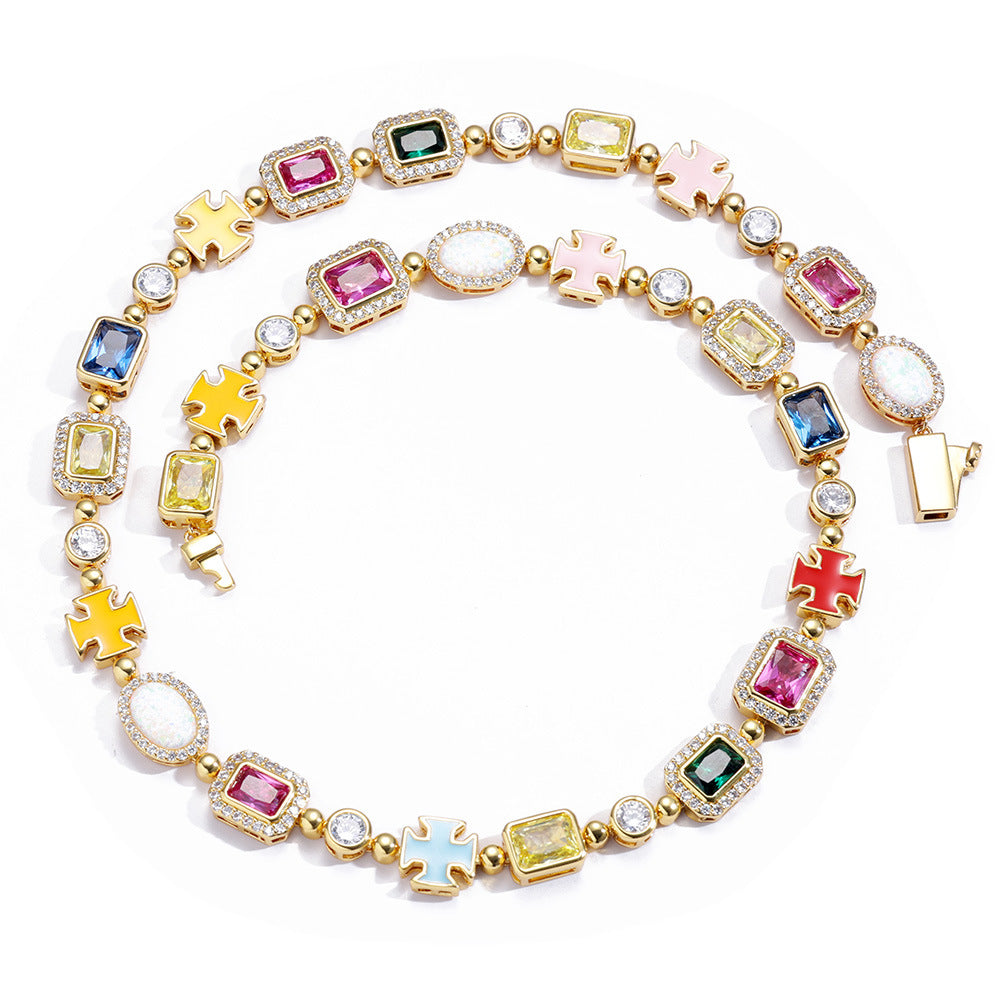 A gold plating brass neacklace, pave halo motifs, main stones in color of emerald, topaz, citrine, garnet. Yellow, blue, red, pink enamel cross motif. Box clasp.