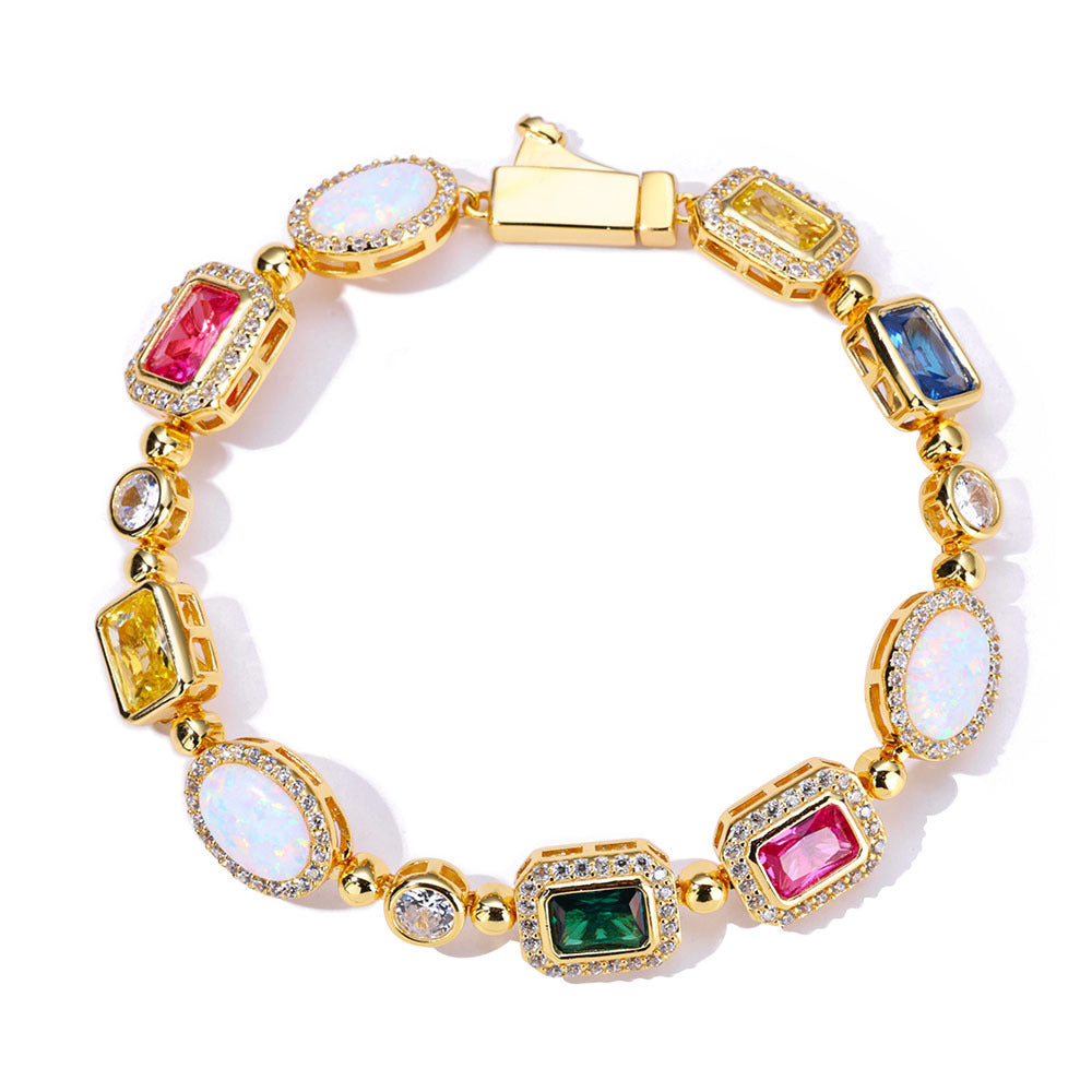 A gold plating brass bracelet, pave emerald cut halo motifs, main stones in color of emerald, sapphire, ruby, yellow diamond, opal. Box clasp.
