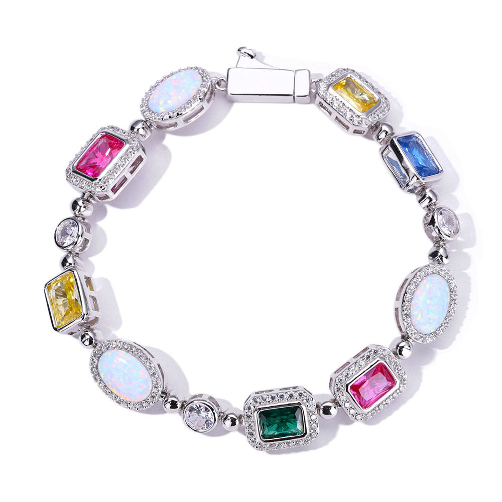 A silver plating brass bracelet, pave emerald cut halo motifs, main stones in color of emerald, sapphire, ruby, yellow diamond, opal. Box clasp.