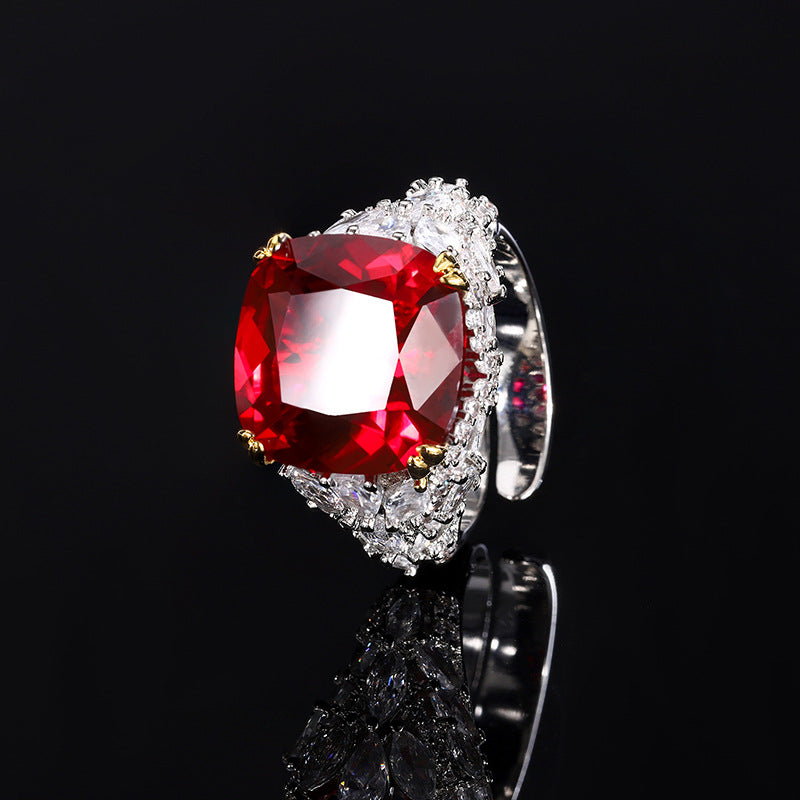 A silver plating beige cocktail brass ring, inlaid with a red center stone and white marquise-cut zirconias.