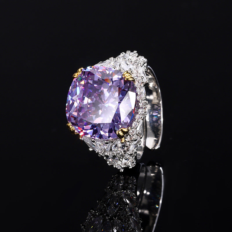 A silver plating beige cocktail brass ring, inlaid with a light purple center stone and white marquise-cut zirconias.