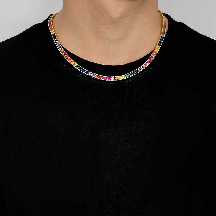 The model showcases the rainbow square gemstone tennis necklace with old plating.