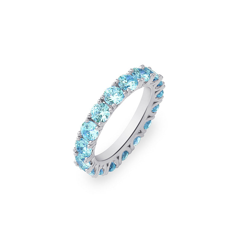 A silver plating brass stacking ring inlaid with blue round brilliant cubic zirconias.