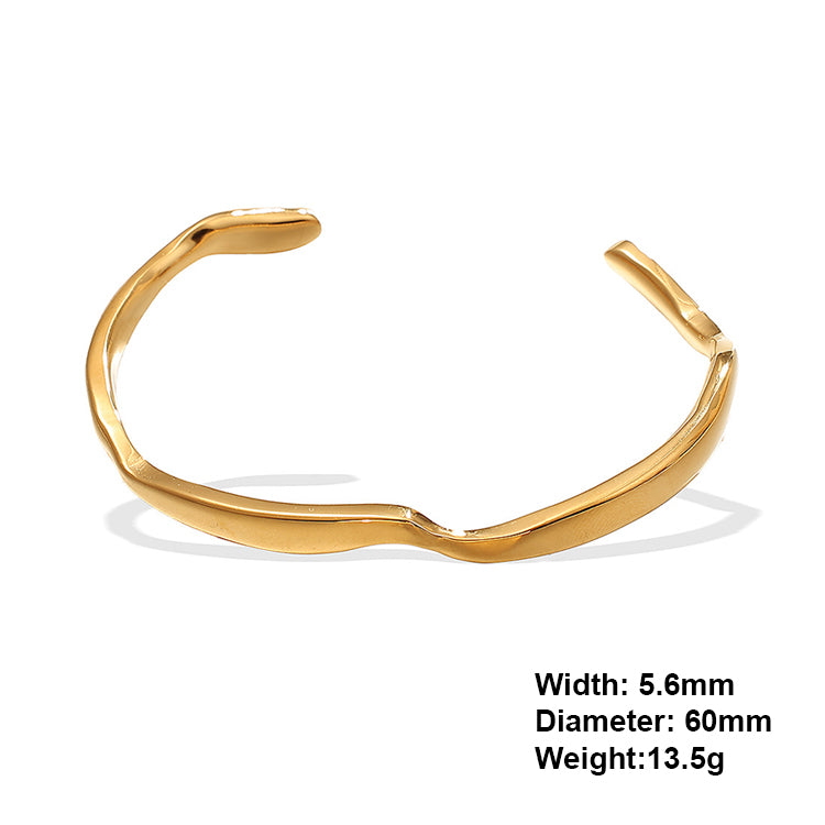 A gold plating wave design stainless steel bangle bracelet
