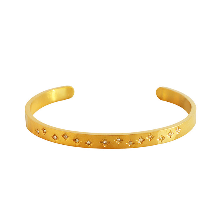 A gold plating star design with many stagger zirconias stainless steel bangle bracelet