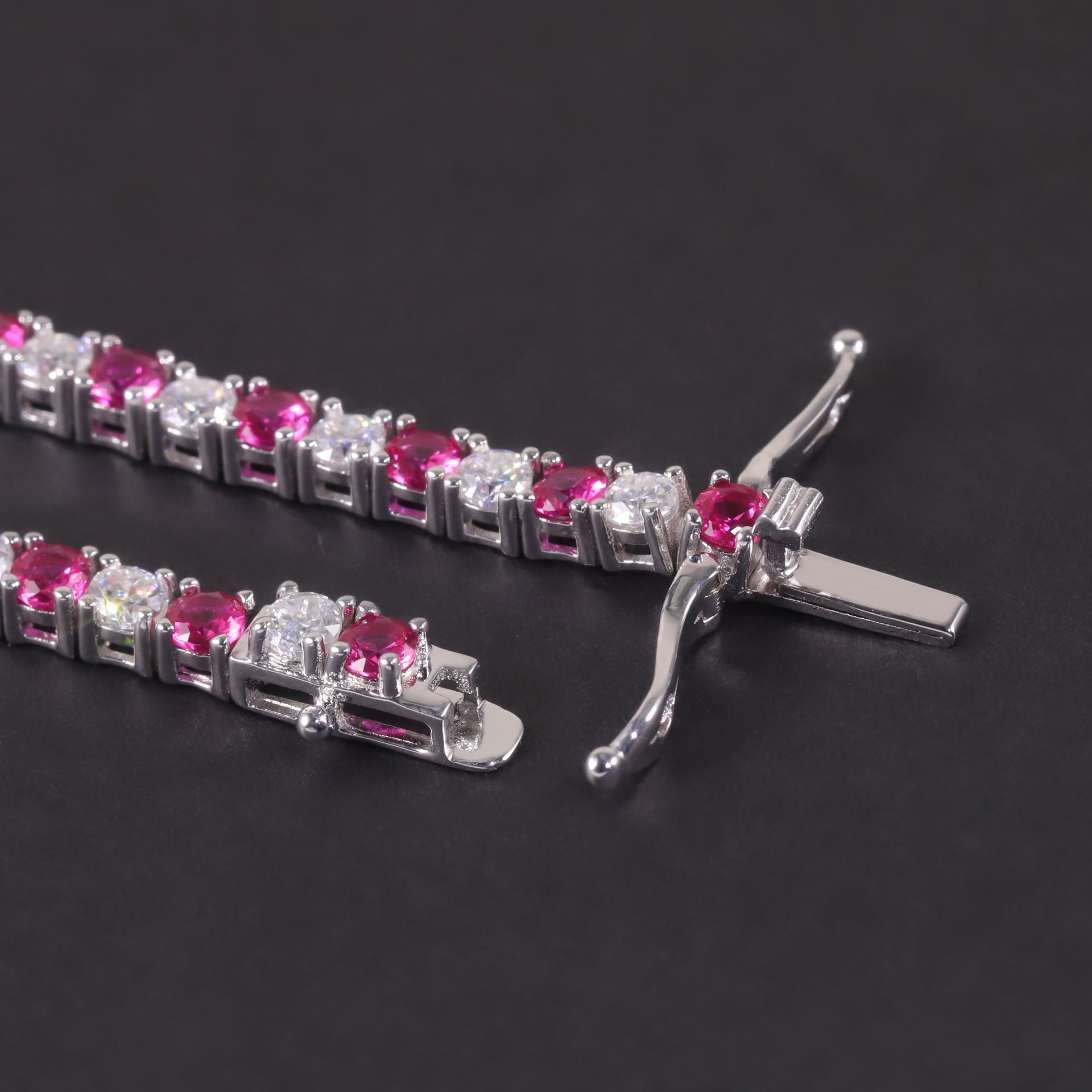 Close-up of the ruby mossanite tennis bracelet clasp, hook clasp.