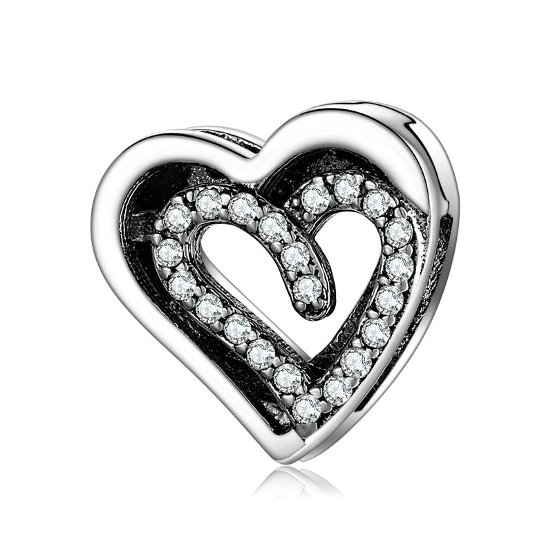 A sterling silver zirconias paved bilayer heart design charm