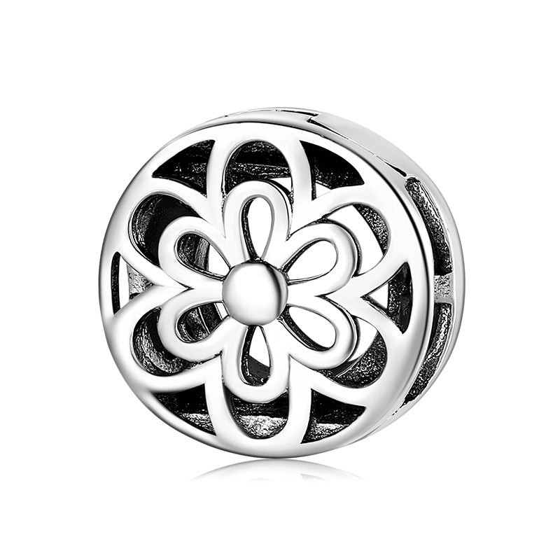 A sterling silver bloom design charm