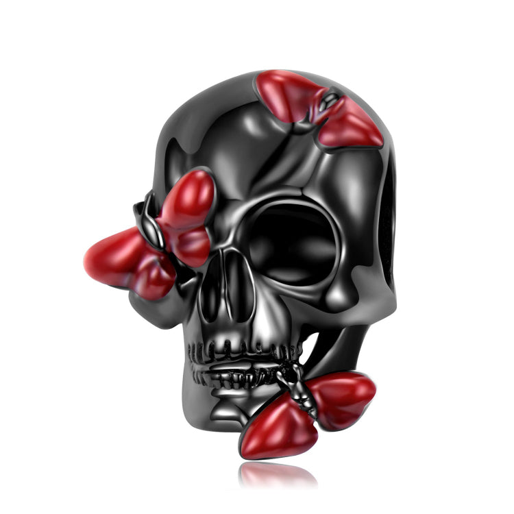 A black plating skull with three red enamel butterfly sterling silver charm