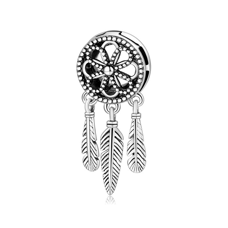 A sterling silver dream catcher design charm