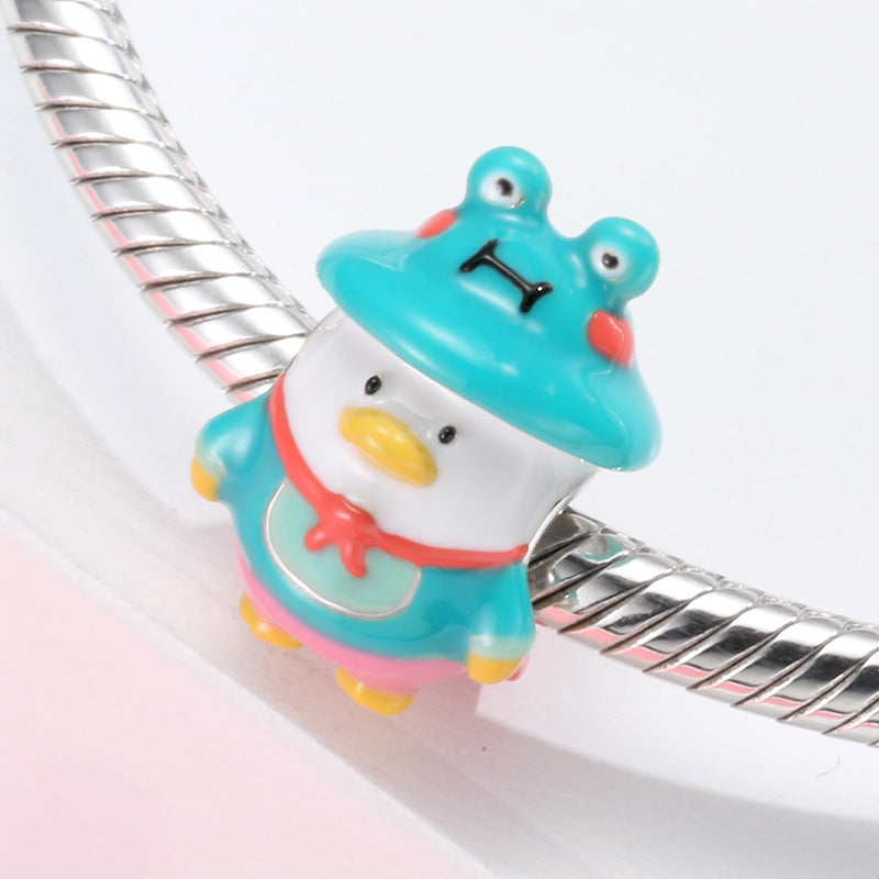 A sterling silver colorful enamel duck wearing frog suit charm