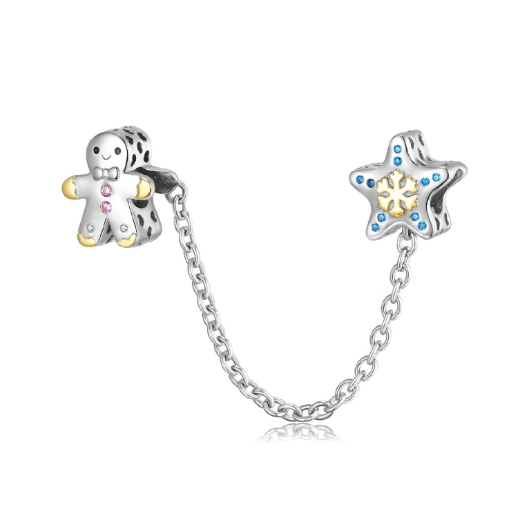 A sterling silver gingerbread man with a snow star safety chain