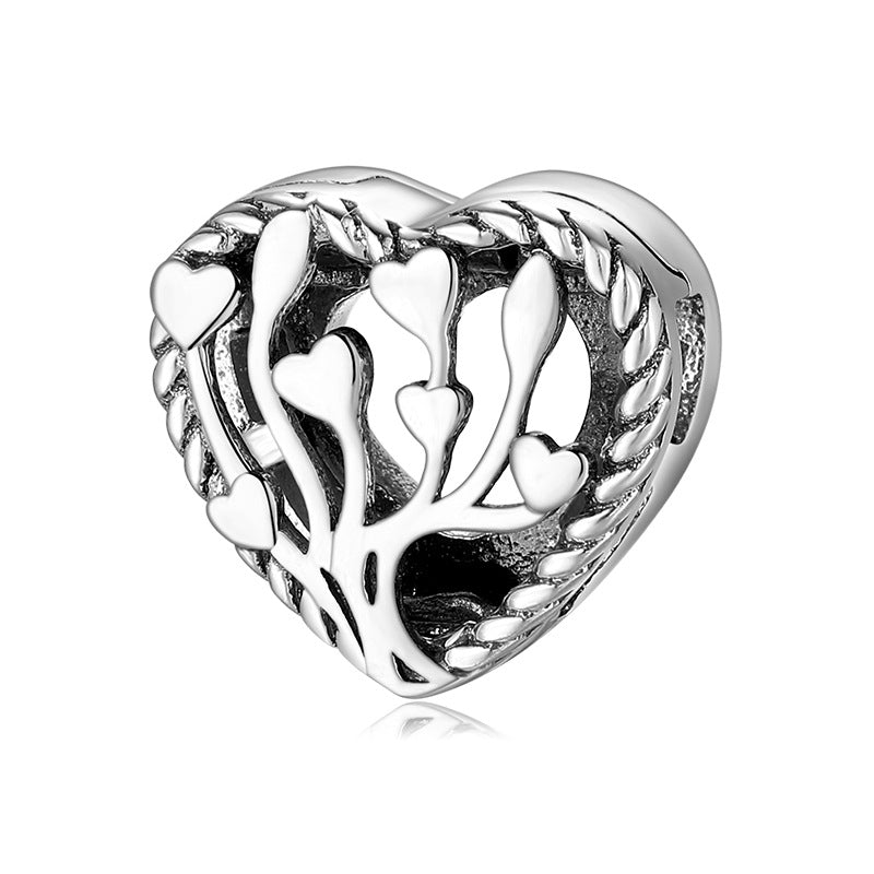 A sterling silver heart tree design charm