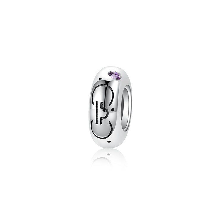 A sterling silver spacer bead, design in Libra pattern and lilac birthstone.