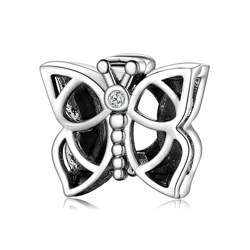 A sterling silver line butterfly design charm
