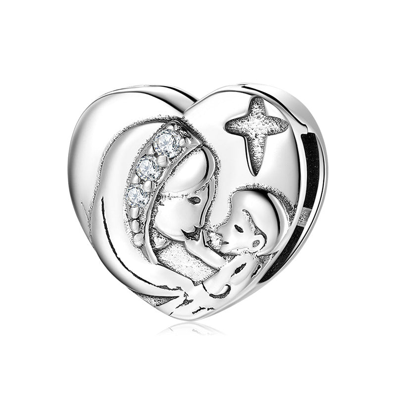 A sterling silver charm showed a mother and a son with three zirconias