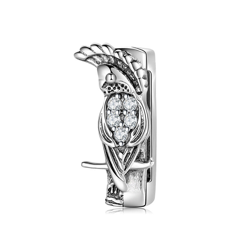 A sterling silver owl design charm