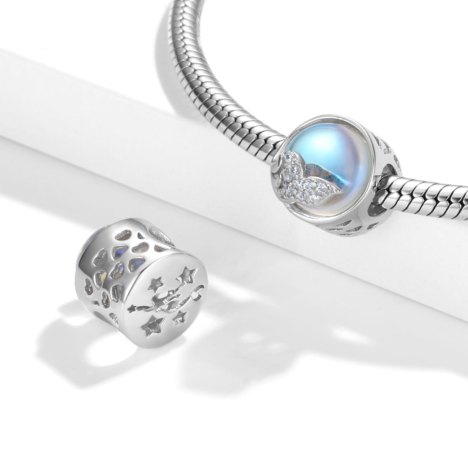 A sterling silver zirconias paved Mermaid's nail, with white pearl charm.