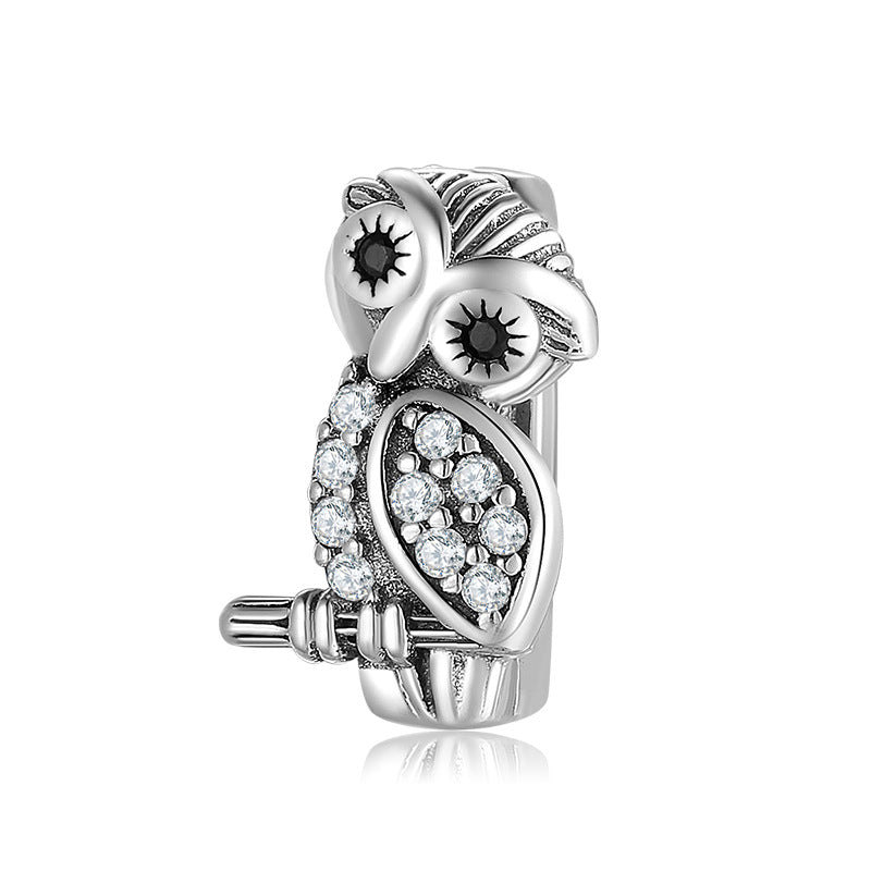 A sterling silver zirconias paved owl charm