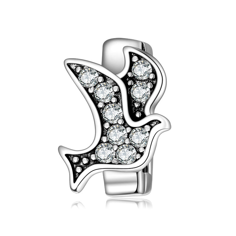 A sterling silver zirconias paved pigeon charm