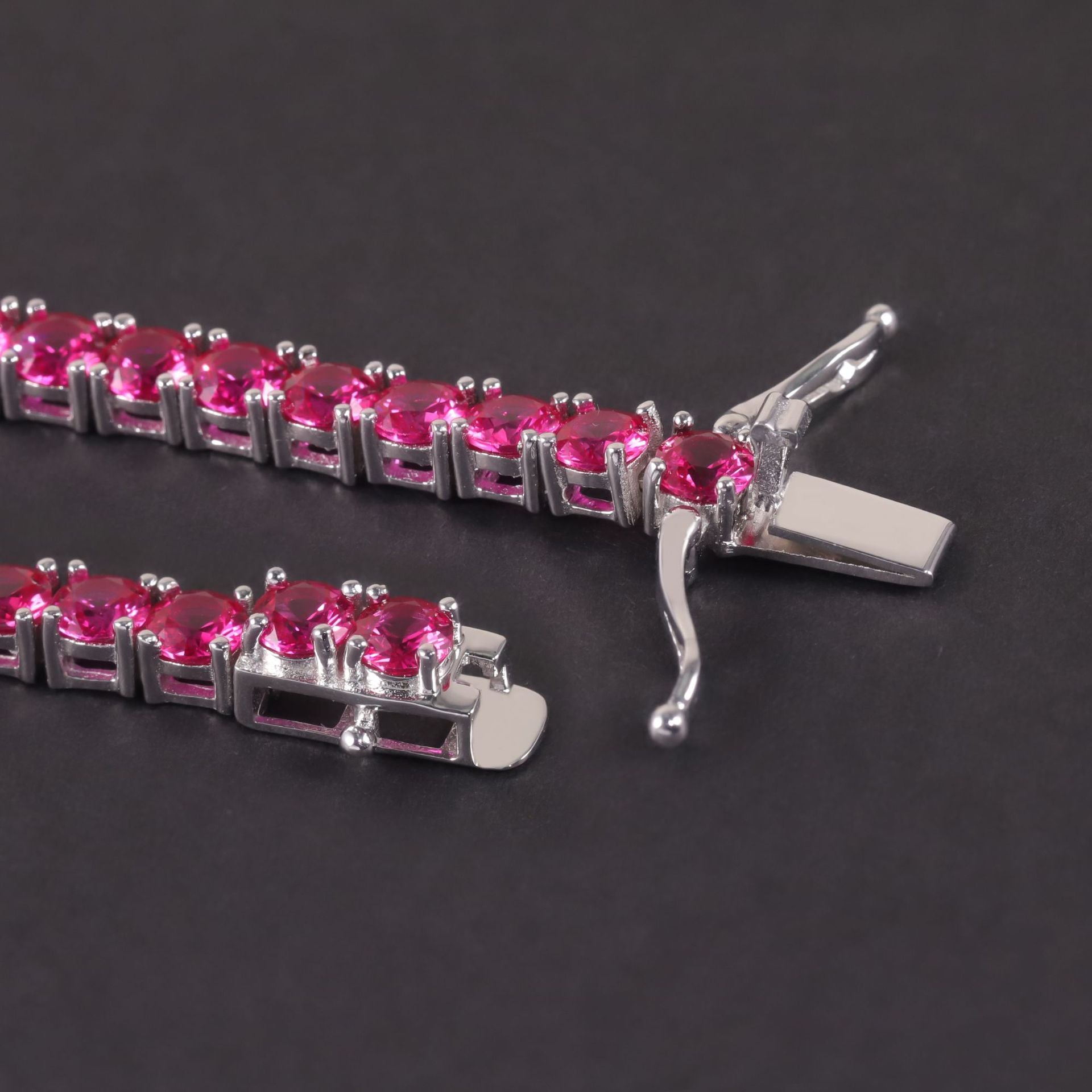 Close-up of the synthetic ruby tennis bracelet clasp, hook clasp.