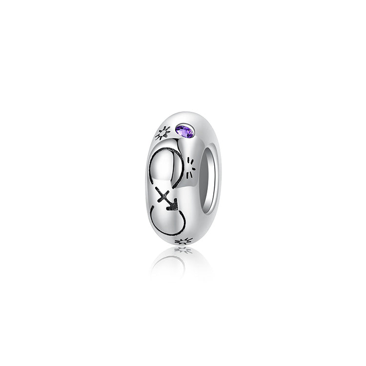A sterling silver spacer bead, design in Sagittarius pattern and purple birthstone.