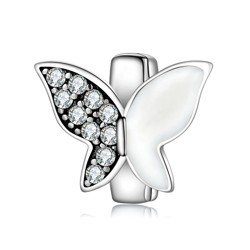A sterling silver paved zirconias with shell butterfly charm