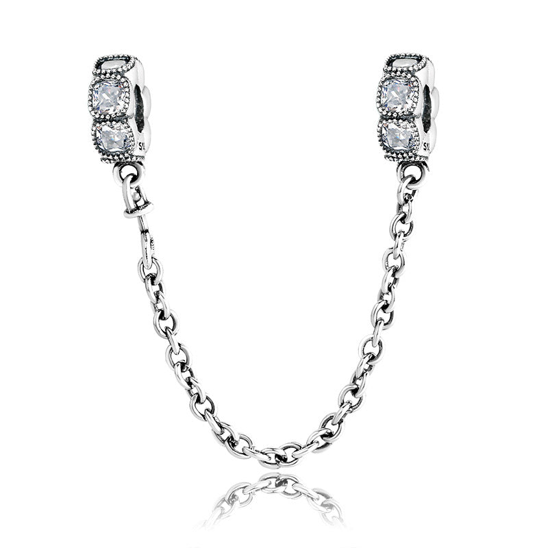 A sterling silver square zirconias paved safety chain