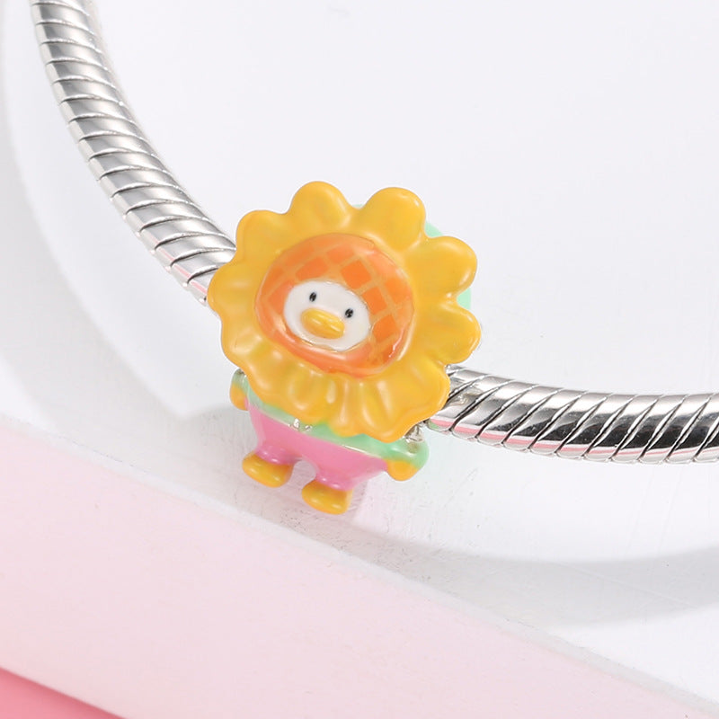 A sterling silver colorful enamel sunflower duck charm