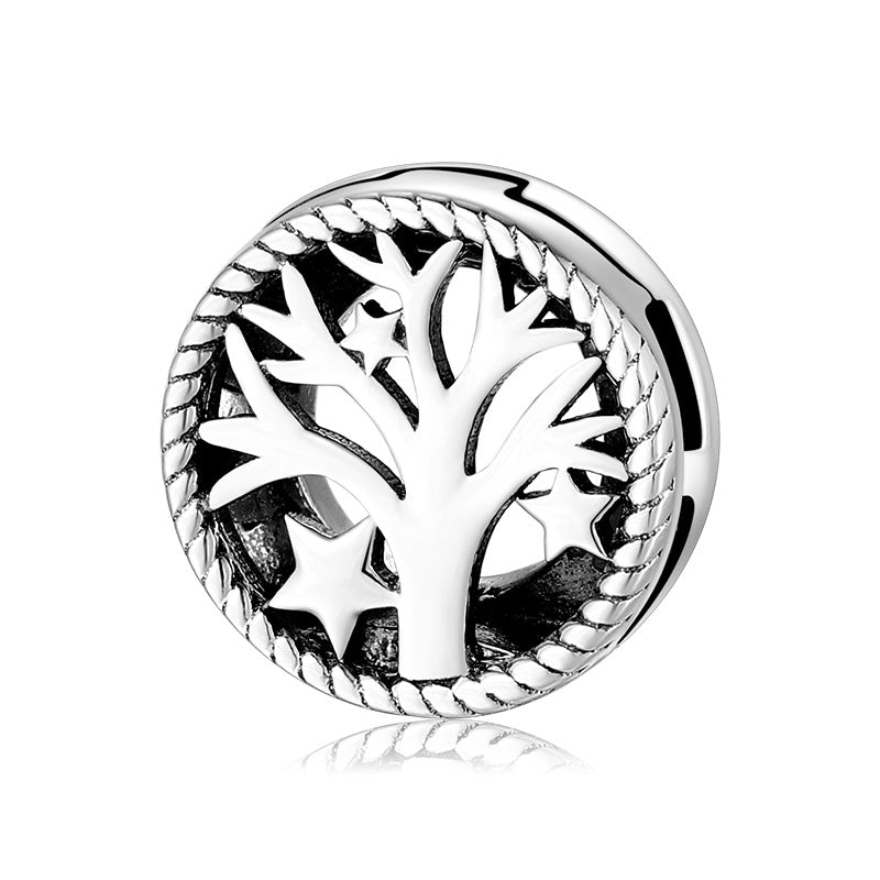 A sterling silver tree and stars charm