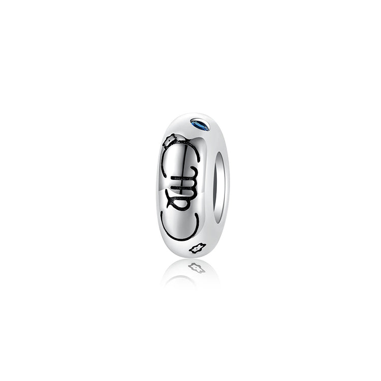 A sterling silver spacer bead, design in Virgo pattern and blue birthstone.