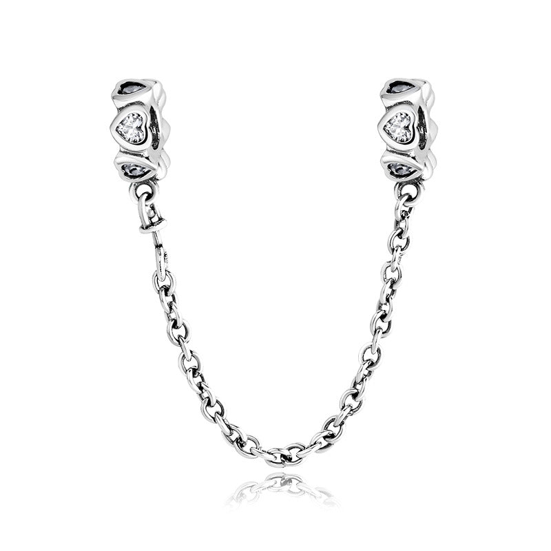 A sterling silver white zirconias paved heart safety chain
