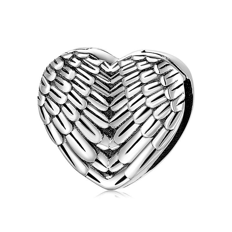 A sterling silver wings design charm