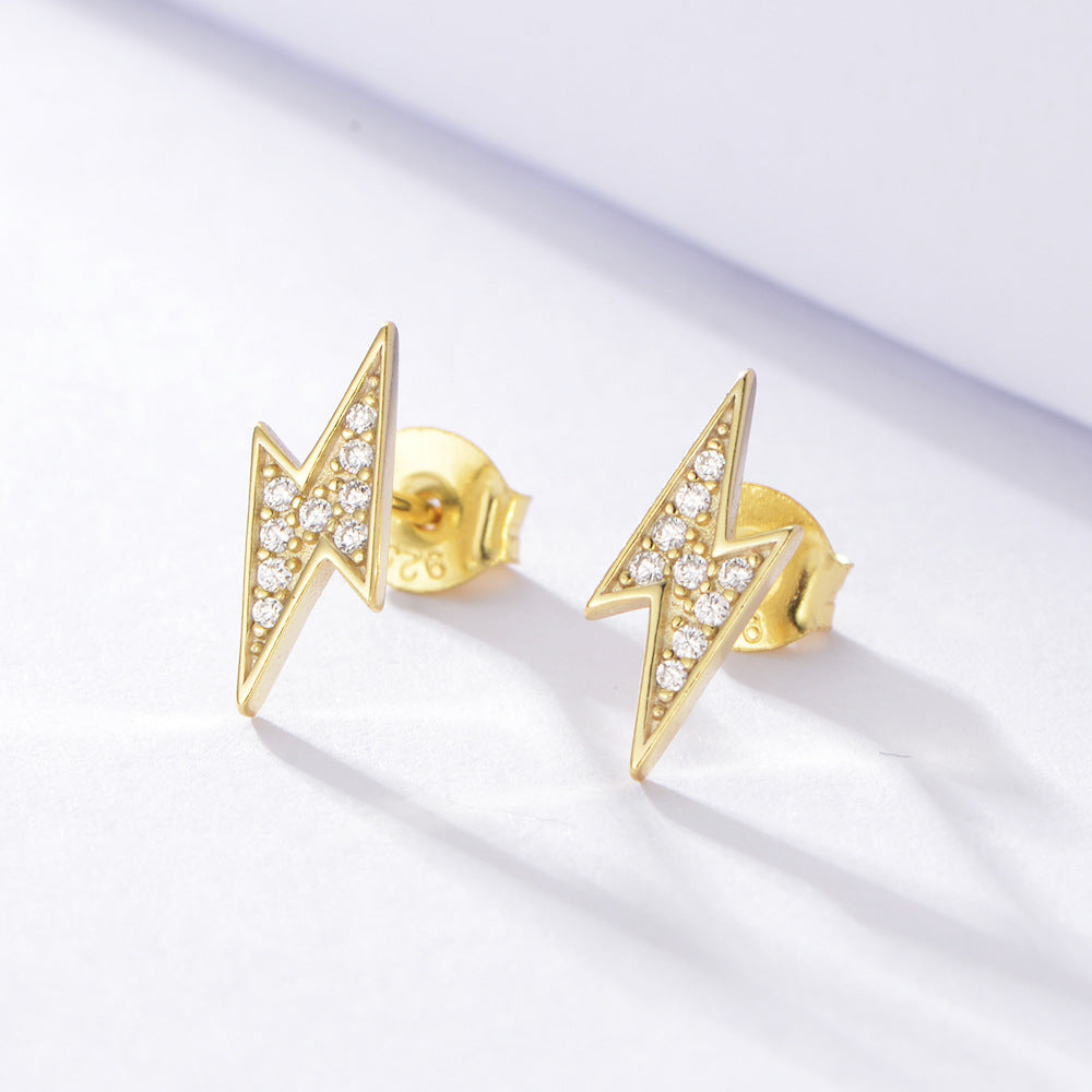 Sterling silver colored gemstone lightning stud earrings, inlaid with white zirconias. Plating with gold.