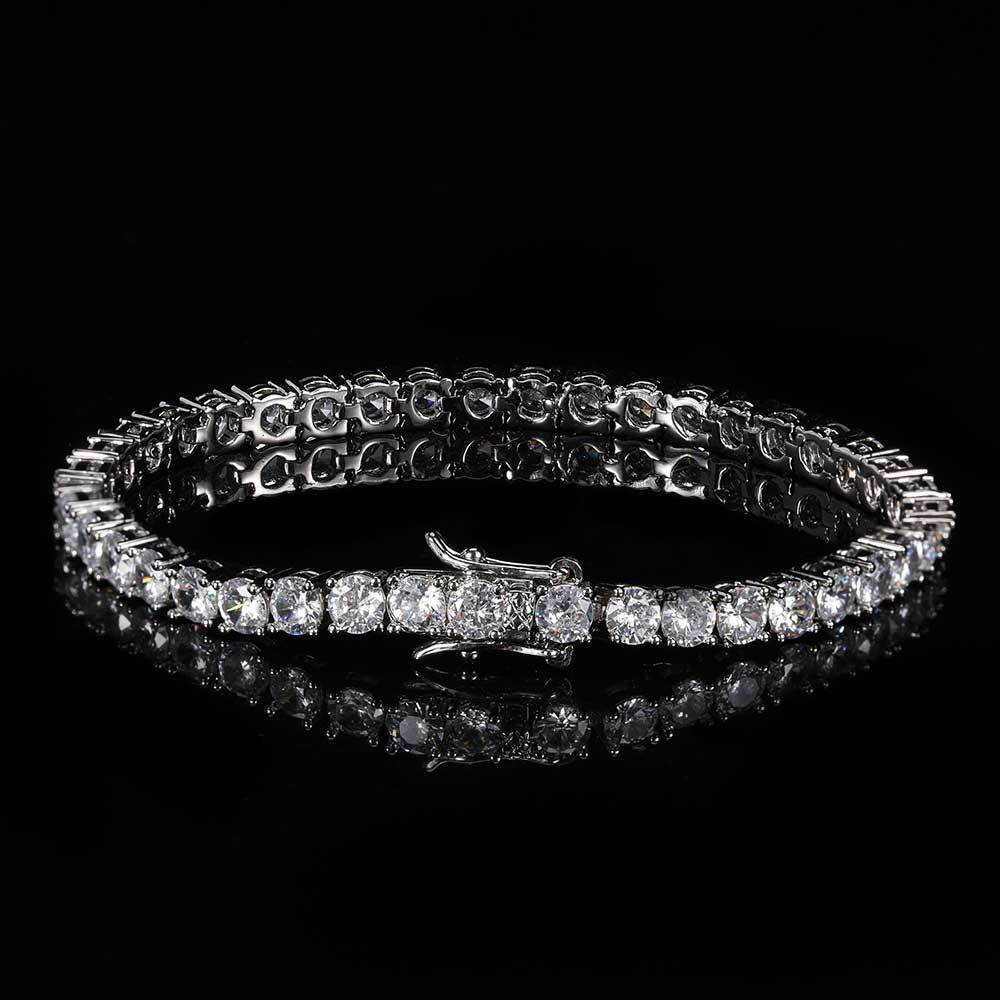 A cubic zirconia tennis chain bracelet. Inlaid with white zirconias, brass with silver plating.