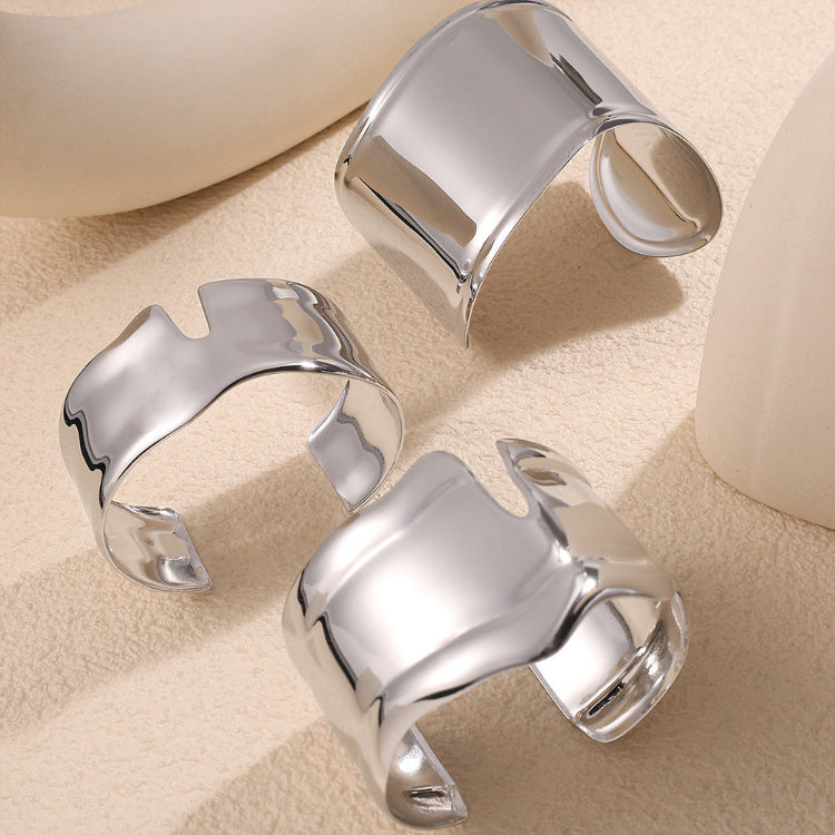 Stainless steel cuff bangle bracelets，design in curves, have irregular openings