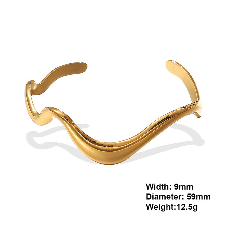 A gold plating wave design stainless steel bangle bracelet